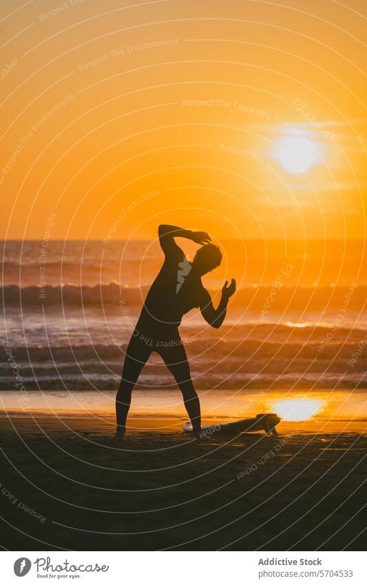 Unrecognizable man doing yoga while standing on beach at sunset pose sea silhouette surfboard surfer water wave nature sand shore ocean male sundown
