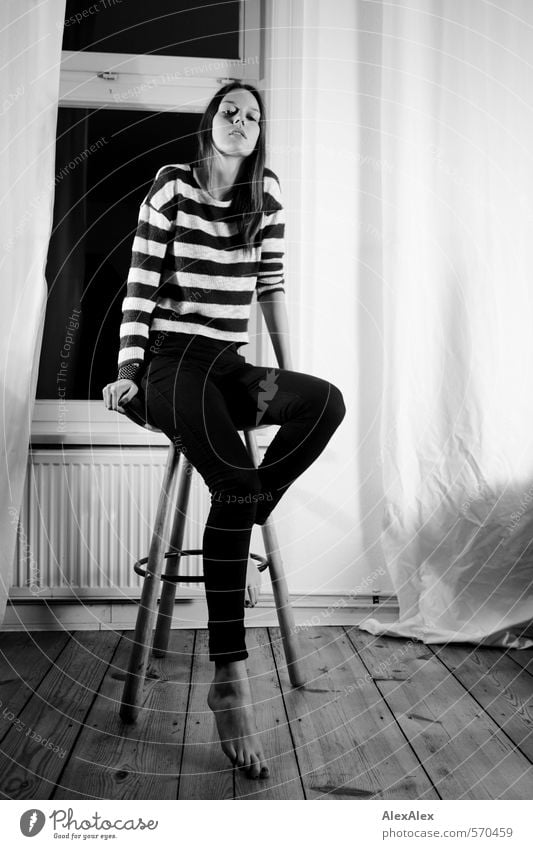 High Young woman Youth (Young adults) Body Legs Feet 18 - 30 years Adults Jeans Striped sweater Barefoot Brunette Long-haired Floorboards Living room Window