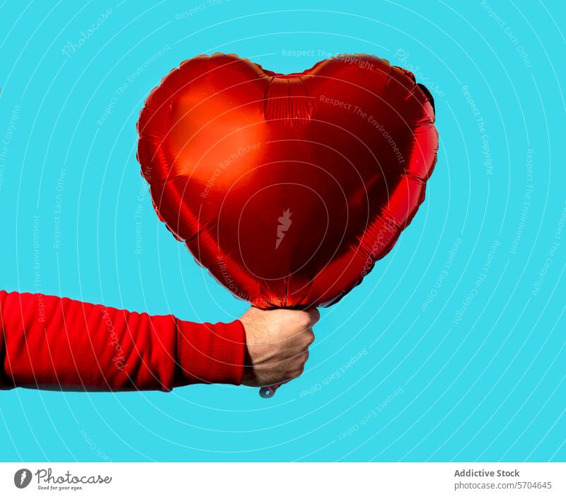 Unrecognizable person hand carrying heart shaped balloon love event occasion st valentines day present festive sweater vivid celebrate symbol bright romantic