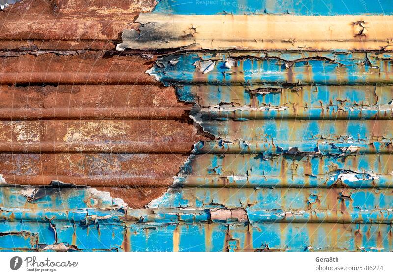 pattern rusty metal surface with remnants of blue and yellow paint paint Ukraine abstract aged backdrop background board burned closeup color ukraine