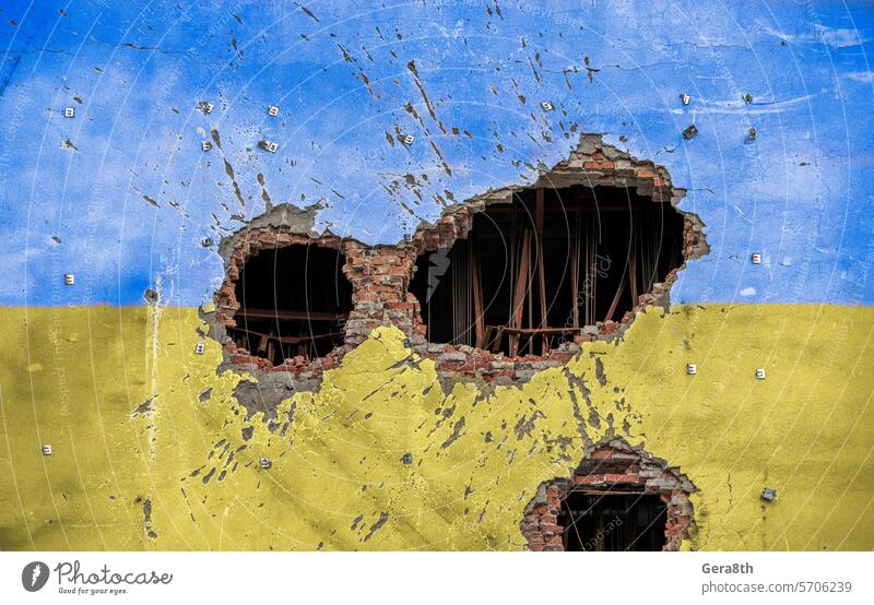 explosion damaged blue yellow house wall war in Ukraine Donetsk Kherson Lugansk Mariupol Russia abandon attack background bahmut blown up bombardment broken