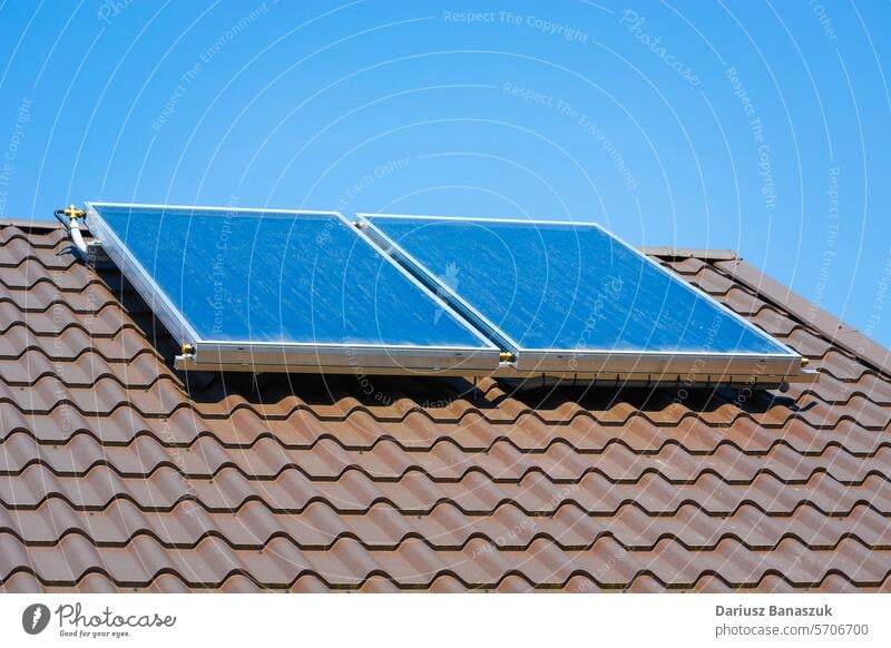 Solar panels on the roof of the house solar electricity technology sky blue sun sunlight modern alternative renewable energy environment power environmental