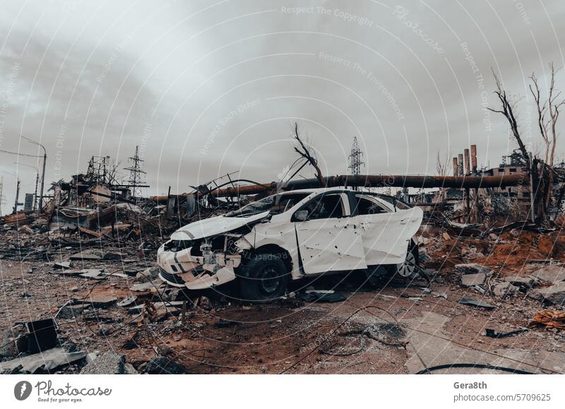 burnt cars and destroyed buildings of the workshop of the Azovstal plant in Mariupol Russia Ukraine abandon attack blackout blown up bombardment broken