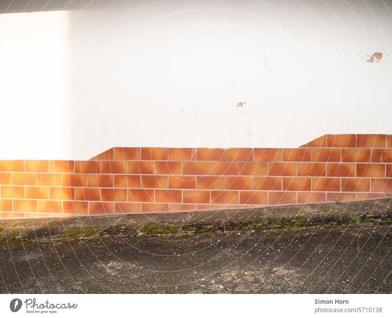Wall on an ascending path Incline Wall (building) upstairs Upward Go up Sun Sunlight Patch of light Building Facade tiled stagger stepped Structures and shapes