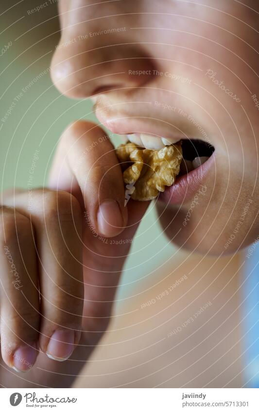 Anonymous girl eating healthy walnut kernel at home Girl Walnut Bite Healthy Nut Hungry Kernel Fresh Diet Food Snack Nutrition Protein Mouth Open Eat Vitamin