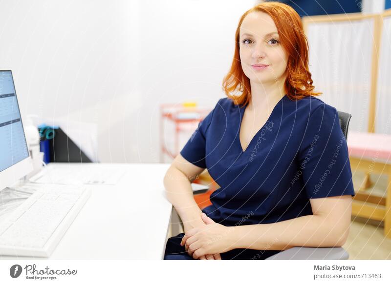 Portrait of a smiling female neurologist looking at camera in the office of a modern clinic. The neurology doctor is at work. portrait woman medical
