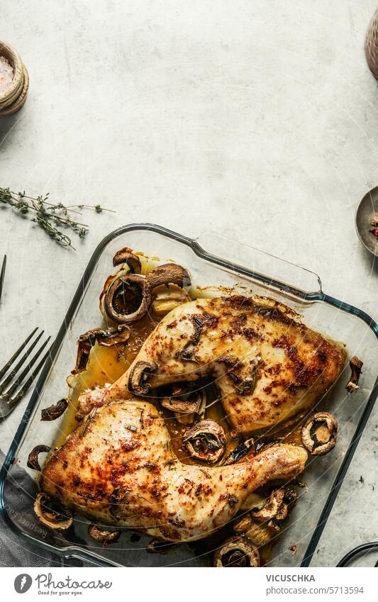 Tasty roasted chicken legs with garlic and mushrooms, top view tasty chicken meat spicy delicious cooking background cooked food fried flat lay above
