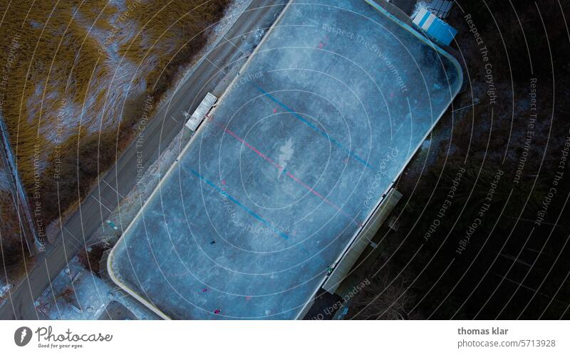 Ice rink from above ice skating Sports Ice skater Winter Blue drone outdoor