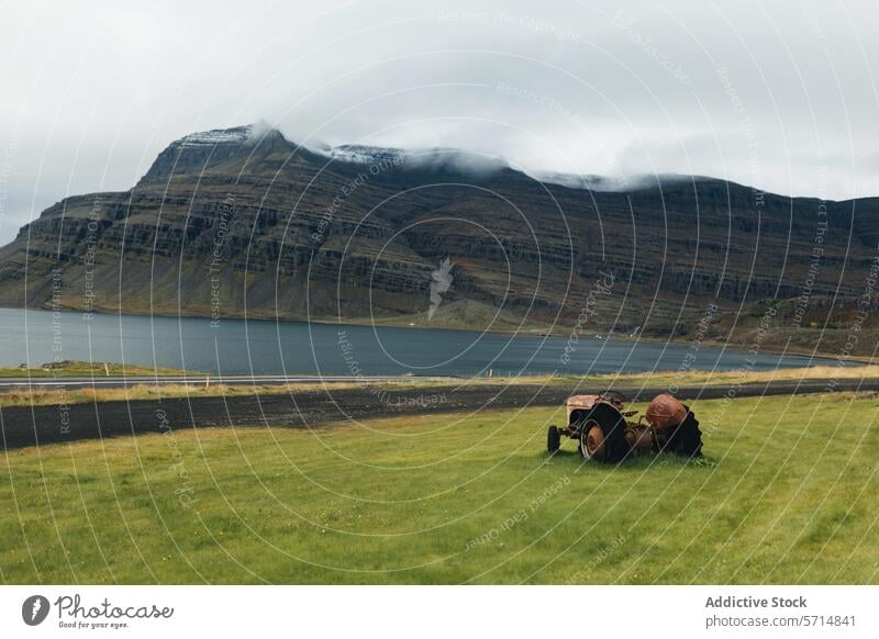 Generated image iceland landscape mountains lake tractor serene tranquil scenic majestic travel destination nature outdoor rustic vintage abandoned agriculture