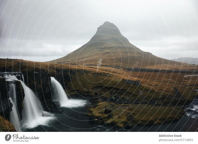 Serene Kirkjufell Mountain with Waterfall in Iceland iceland kirkjufell mountain waterfall cascade mist cloudy serene iconic nature scenic landscape travel