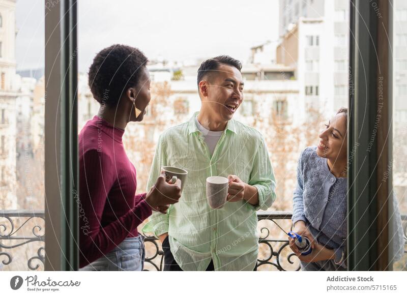 Friends sharing laughter over coffee on a balcony friendship urban conversation enjoyment multicultural diverse cityscape leisure relaxation break morning