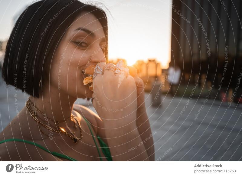 Woman Enjoying a Burger in Madrid's 4 Towers Area woman burger eating sunset madrid urban four towers cuatro torres street food casual lifestyle young adult