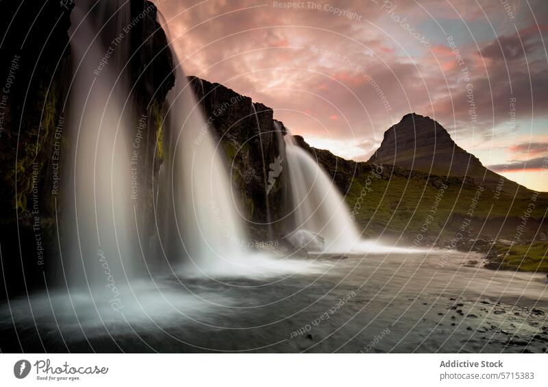 Majestic Waterfall at Sunset in Iceland waterfall iceland kirkjufell mountain sunset landscape nature cascade smooth flow majestic evening dusk twilight serene