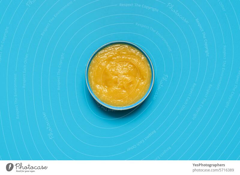 Apple sauce bowl above view, isolated on a blue background apple autumn bright color compote copy space cuisine cut out delicious design dessert diet dish