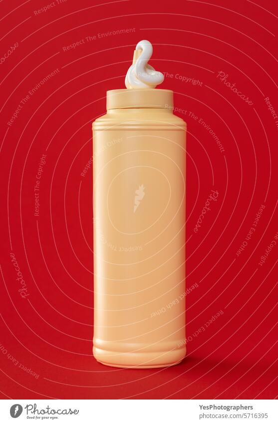 Mayo plastic bottle isolated on a red background blank bright clean color condiment copy space cream creative cuisine cut out delicious design drip eating empty
