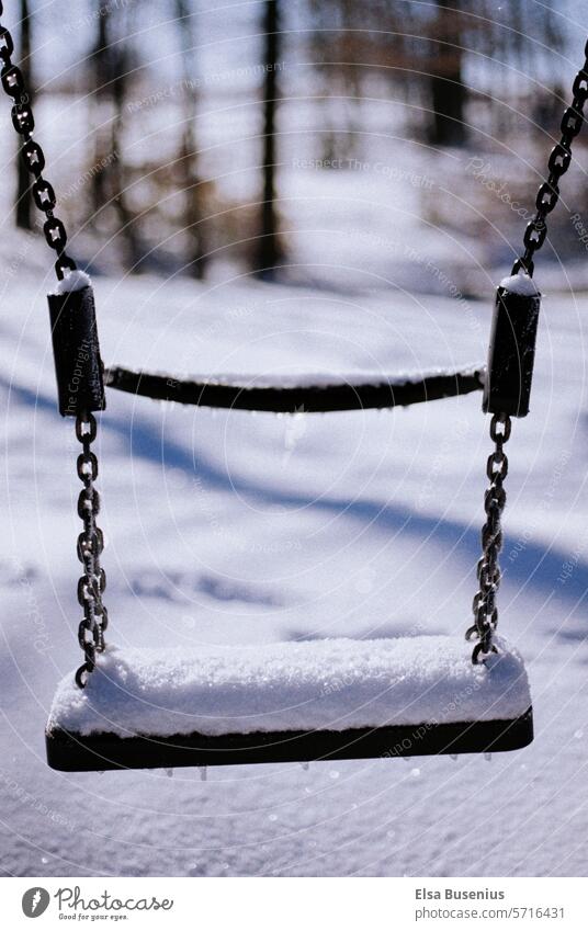 snow-covered swing Swing Snow lost places Playground Icicle Deserted Winter Loneliness Exterior shot idyllically Climate Analogue photo Seasons Weather