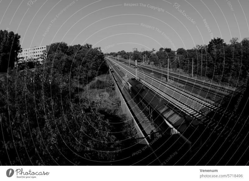 Analog black and white photography, train tracks and a parked train in the small town of Luckenwalde near Berlin Analogue photo analog photography analog image