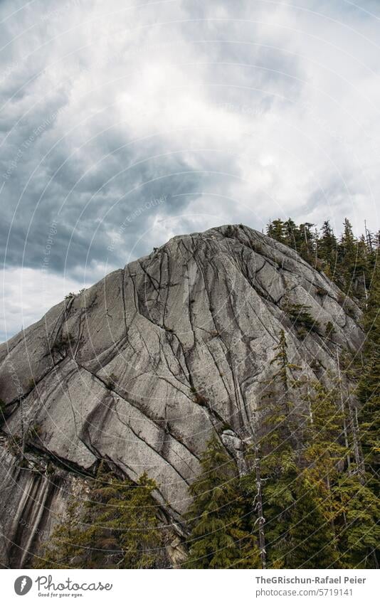Epic rock in front of a cloudy sky Canada Rock Mountain Climbing trees Sky obsessed Squamish rocky Landscape Nature Hiking Tourism mountains Vacation & Travel
