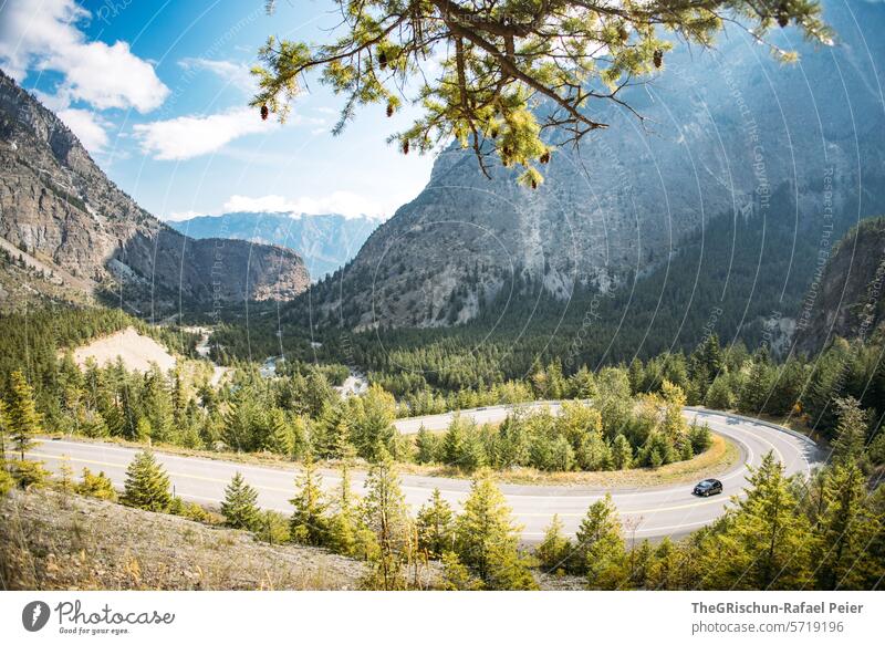 Car drives up the hill on a big bend Street Canada Forest Lake Mountain lillooet travel Motoring mountain Water mountains Tree trees woodland Tourism Landscape