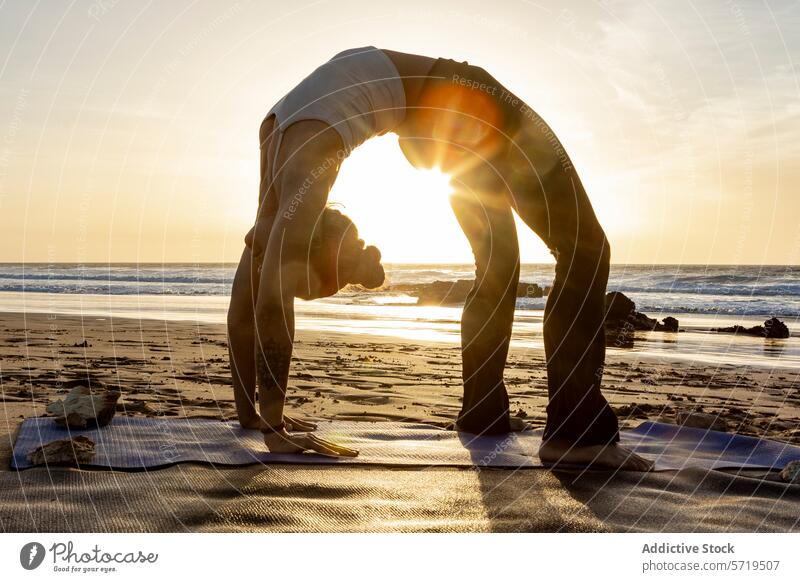 Serene beach yoga with a stunning Wheel Pose at sunset pose serenity wheel pose backbend stretch fitness health well-being exercise meditation tranquility peace