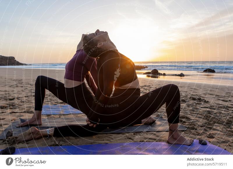Sunset beach yoga session in a peaceful setting sunset asana relaxation fitness wellness nature serenity silhouette exercise meditation harmony balance health