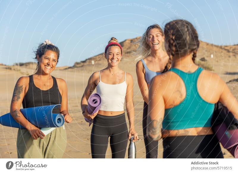 Joyful friends preparing for yoga on the beach at sunset women class woman happy prepare mat carry sandy group cheerful fitness wellbeing exercise together