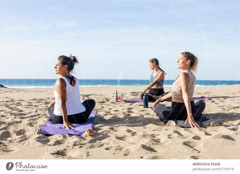 Serene Yoga Session on Beach at Sunset yoga beach sunset sandy ocean tranquil serene practice individual calm background mat posture pose fitness wellness
