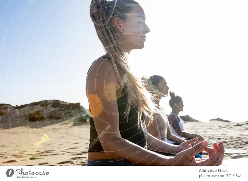 Peaceful beach yoga session during sunset meditation relaxation practice serenity peace mindfulness wellness health fitness exercise sand ocean waves evening