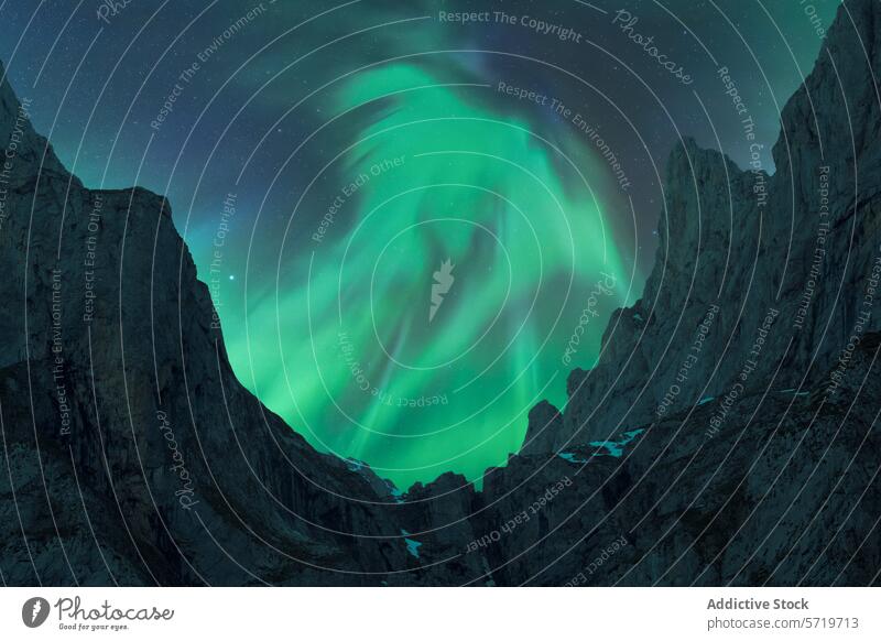 Majestic Northern Lights above Iceland's Rugged Landscape northern lights aurora borealis iceland night sky jagged mountain ethereal green dance mystical