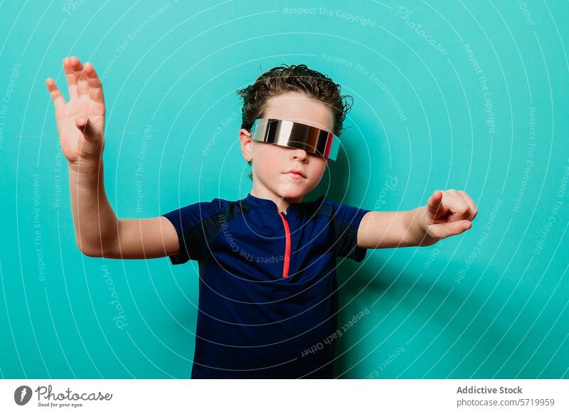 A child in a visor and sporty shirt takes on a superhero stance against a playful turquoise background pose party kid futuristic eyewear portrait fashion