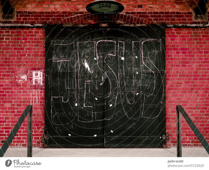 JESUS at the gate Goal Jesus Word chalk writing Copy Space Handwriting Capital letter Characters Signs and labeling Religion and faith Street art Brick wall