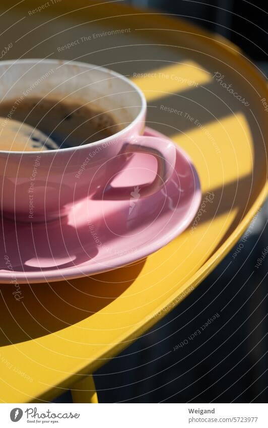 Pastel pink coffee cup with coaster on a round bright yellow table, bathed in light and shadow by the sun Coffee Break Cup Pink Yellow Table luminescent