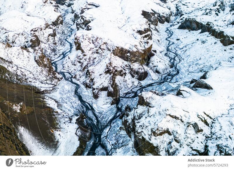 Aerial view of snow-covered northern rivers weaving through landscape aerial pattern terrain winter rugged nature cold curving outdoors topography natural