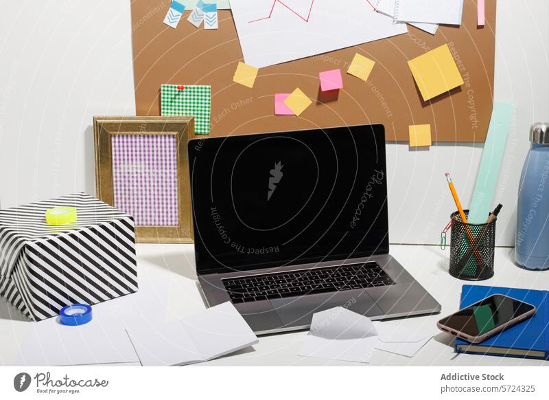 Generated image office desk laptop stationery sticky note workspace modern office supply cork board frame striped cover water bottle pencil pencil holder