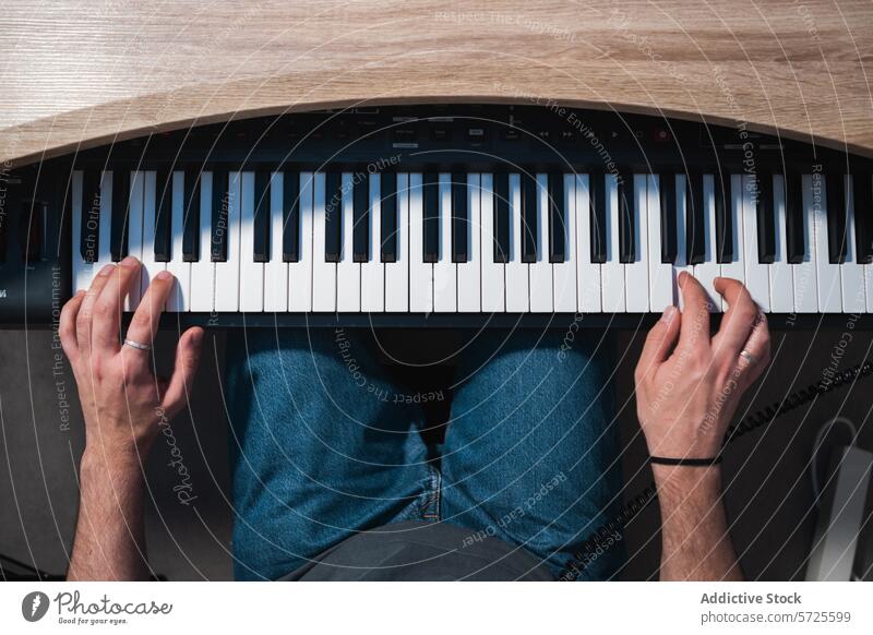 Musician playing keyboard at a recording studio musician overhead sound session hands creativity performance artist instrument synthesizer electronic producer