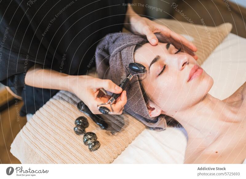 Relaxing facial massage at a wellness spa with jade roller woman skincare relaxation tranquil treatment beauty serene pampering therapy health aesthetic