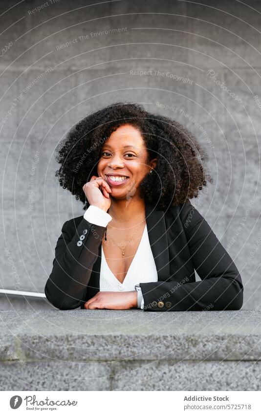 Professional woman smiling outdoors in a casual pose african american smile friendly professional attire businesswoman joyful person female executive black