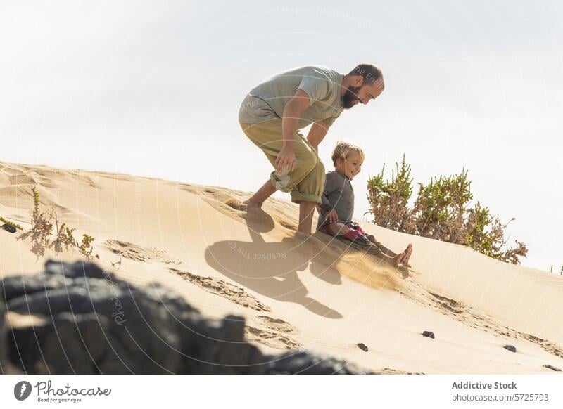Playful family moments on a sandy beach dune father child play joy sunlight vegetation shadow pattern outdoor summer fun vacation holiday leisure bonding