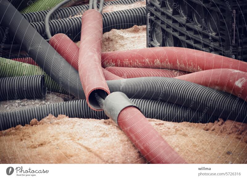 Training ground for string-pullers Hose hoses Construction site Sand Cable Transmission lines cable protection construction reeds Plastic Protective hose