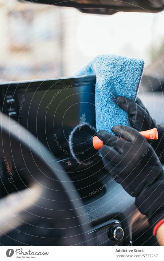 Car detailing with a microfiber towel and brush car cleaning maintenance interior vehicle care hand glove cleanliness upholstery dashboard service auto work