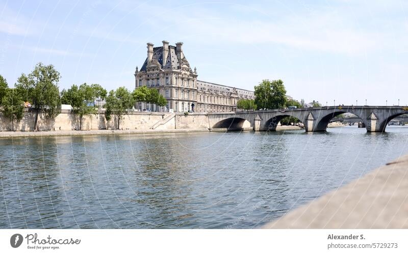Seine in Paris with riverbank and Pont du Carrousel, the Louvre in the background River Bridge France Tourism City Water River bank Promenade French cityscape