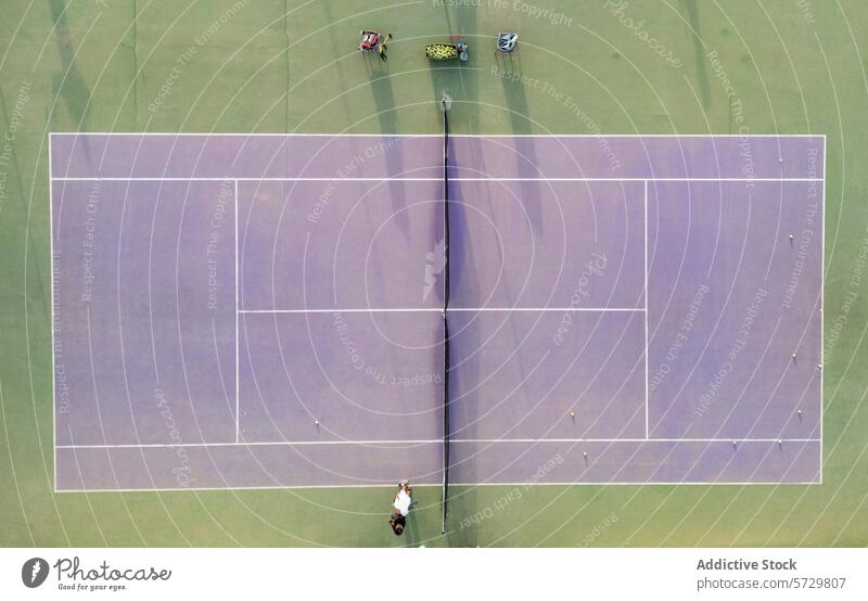 Aerial view of players on a tennis court during a game aerial serve ball sport overhead shot outdoor racquet match competition athletic activity net boundary