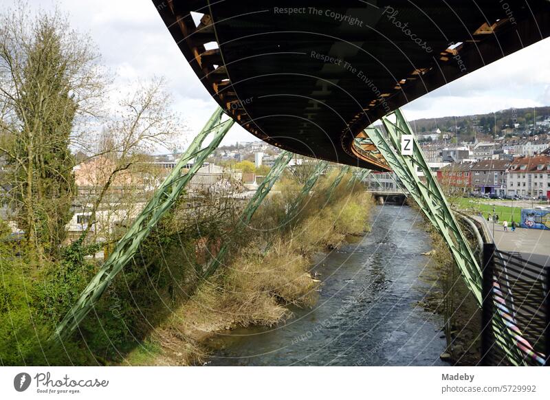 Steel girders of the route of the Wuppertal suspension railroad over the Wupper in the spring sun in the city center of Wuppertal in the Bergisches Land in North Rhine-Westphalia, Germany