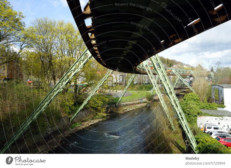Steel girders of the tracks of the Wuppertal suspension railroad over the river Wupper in the spring sun in the city center of Wuppertal in the Bergisches Land region in North Rhine-Westphalia, Germany