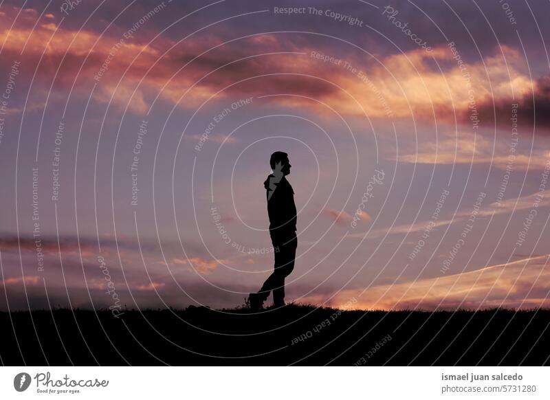 man silhouette in the countryside in the summertime and sunset background person one person shadow nature landscape view sunlight traveling lifestyle adventure