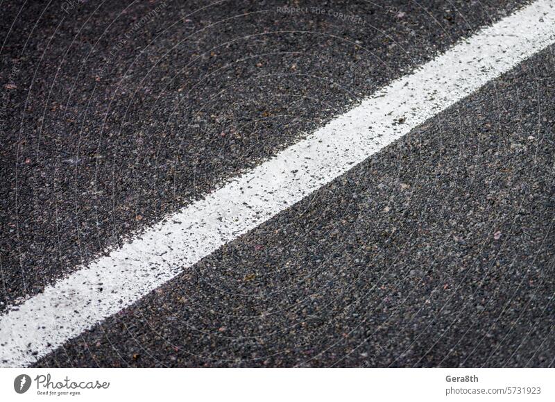 white streak of paint on gray asphalt asphalt pattern auto automobile background black coating continuous detailed diagonal drive empty fast geometry grey