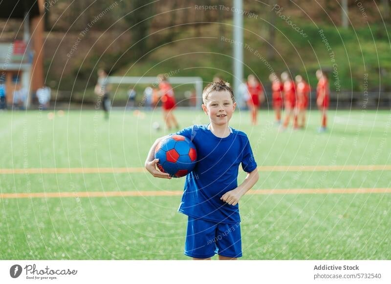 Young soccer player on field with ball and team boy sportswear soccer ball teammates practice young athlete youth active outdoor training exercise football