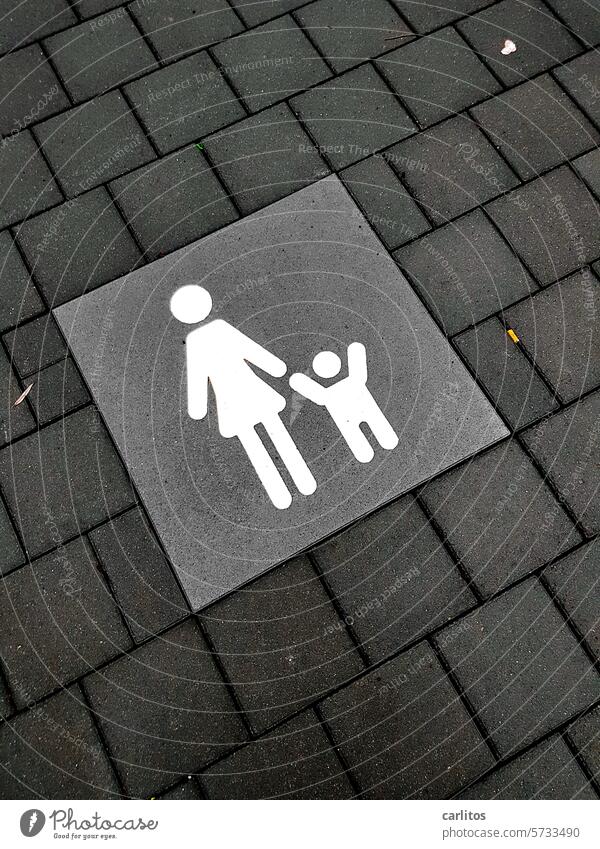 Mother with child | Pictogram Child Family Parking lot Concrete pavement Gray Signs and labeling Signage Clearway Road sign
