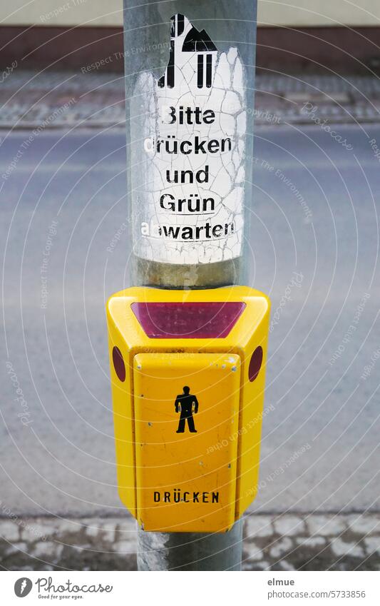 Mindfulness I Please press and wait for green - is written above the yellow traffic light button Traffic light push button Traffic light pusher Roadside