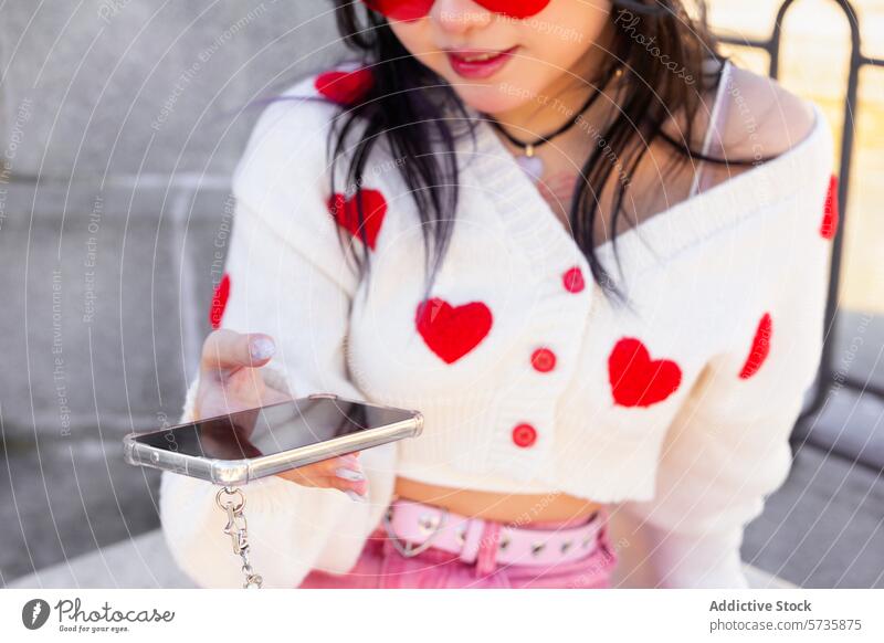Fashionable Gen-Z Girl with Smartphone and Heart Cardigan gen-z girl model smartphone fashion style youth trendy cardigan heart sunglasses modern casual outdoor